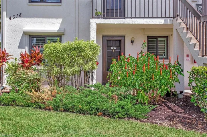 Lush landscaping featuring ornamental shrubs and varied plantings