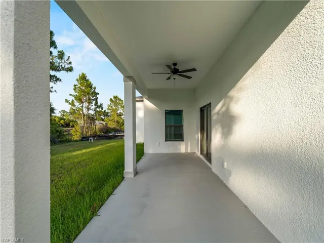 View of patio featuring ceiling fan