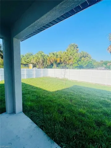 View of fenced backyard