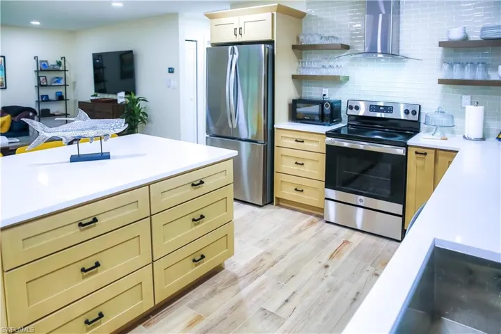 A large island provides additional seating and prep space, making it easy to gather while cooking.