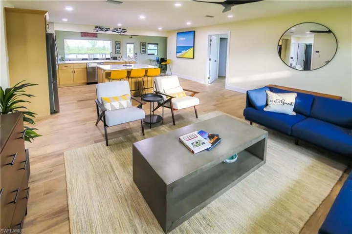 Open concept living space is filled with natural light from the large windows.
