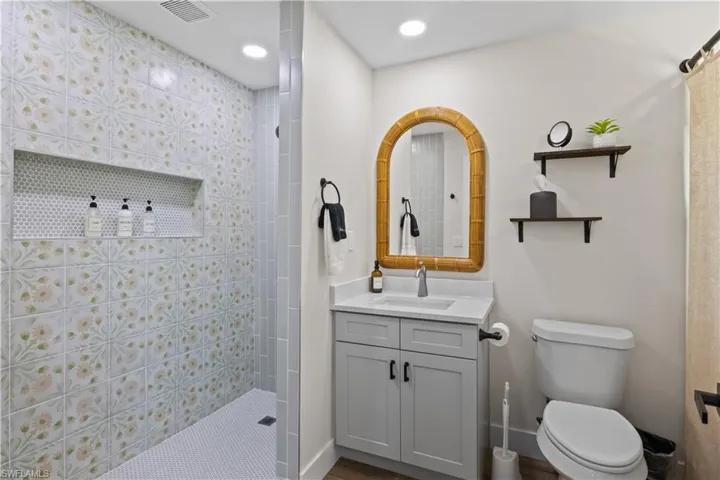 Private en-suite bathroom boasts modern finishes, a spa-like shower, and ample vanity space for ultimate convenience.