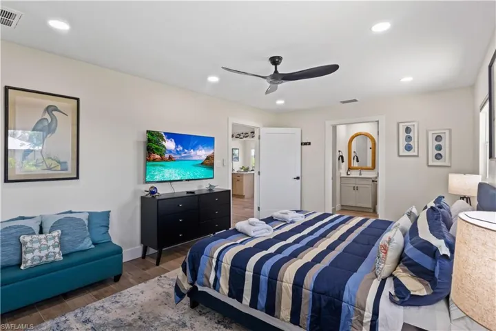 The room features a large layout with plenty of space for a king-size bed and additional seating.