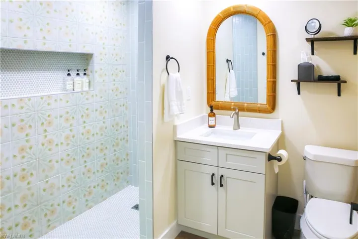Private en-suite bathroom boasts modern finishes, a spa-like shower, and ample vanity space for ultimate convenience.