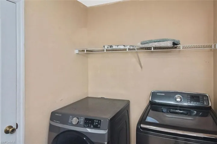 Laundry room featuring washing machine and clothes dryer