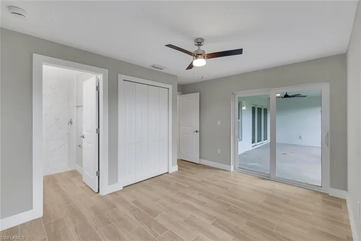 optional second owner's suite with private bath and lanai access/segundo dormitorio principal con bano privado y acceso a la terraza