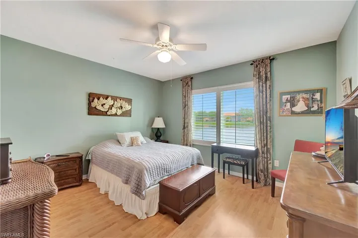 Bedroom featuring light hardwood / wood-style flooring and ceiling fan