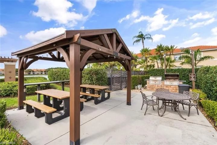 View of patio featuring a gazebo and area for grilling
