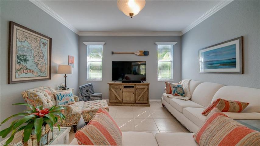 Fresh paint, window treatments, and pristine 20" tiles make this space a comfortable space.