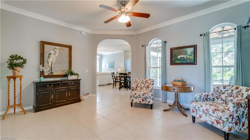 Fresh paint, beautiful crown molding, and 20" tile warmly welcomes.