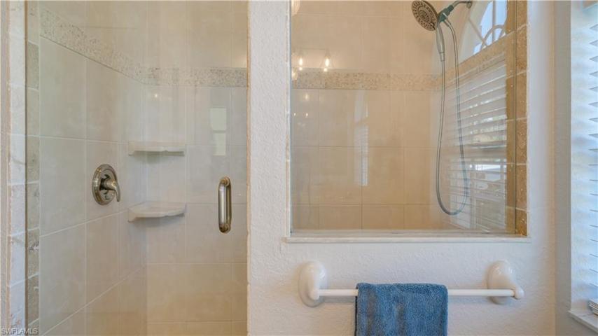 Look at this oversized, walk-in shower. The tile glistens...like new.