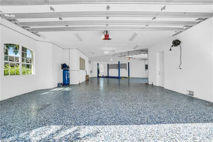 Garage featuring a garage door opener
