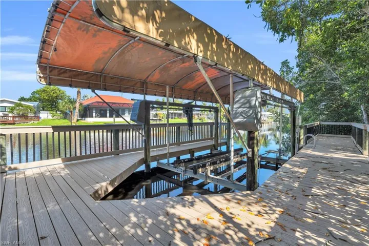 Dock area featuring a water view