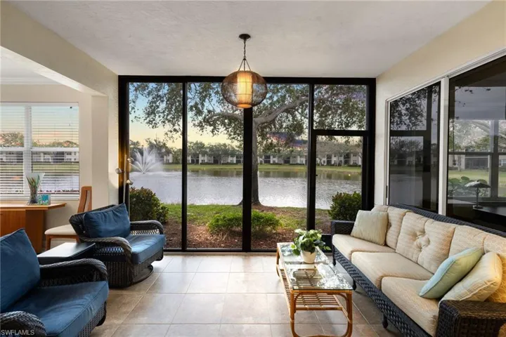 Sunroom with a water view