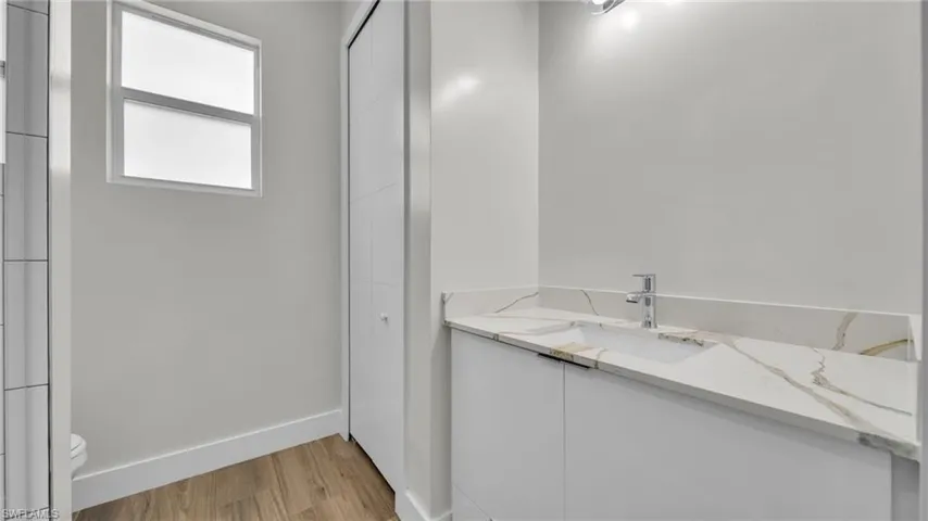 Bathroom with vanity and light wood-style flooring