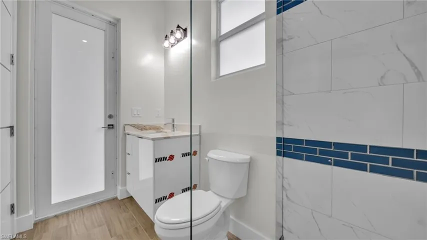 Bathroom with vanity and light wood finished floors