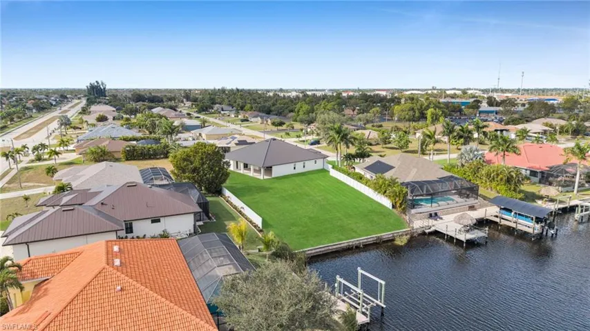 Aerial view of residential area with a nearby body of water