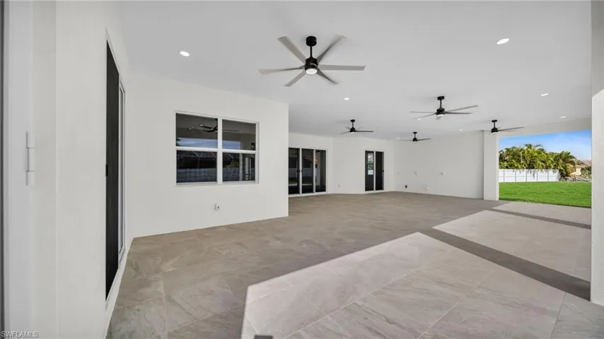 Unfurnished living room featuring recessed lighting