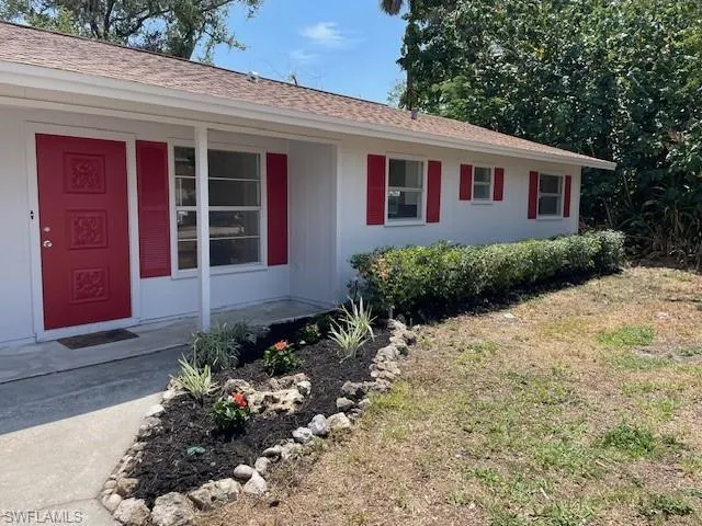 Single story home featuring a porch
