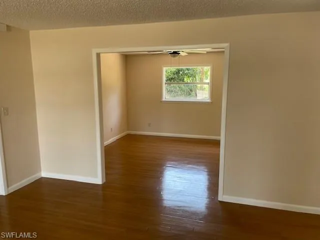 Empty room with wood finished floors and baseboards