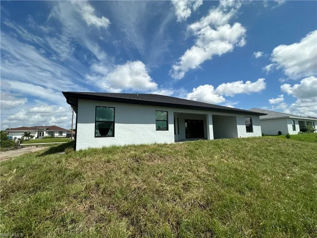 Back of structure with covered patio