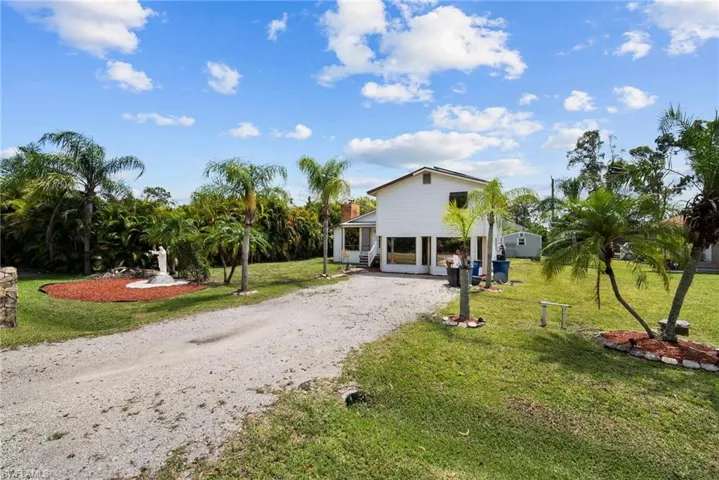 View of front of property with a front lawn