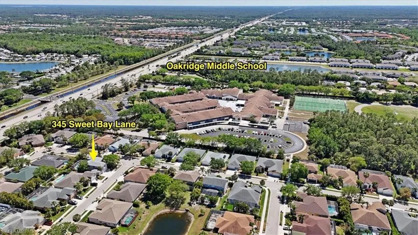 Aerial view featuring a water view and a residential view
