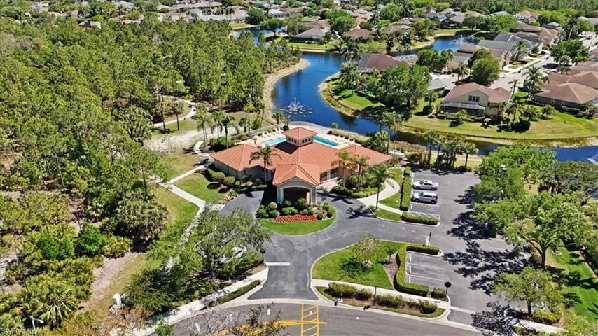 Aerial view featuring a residential view and a water view