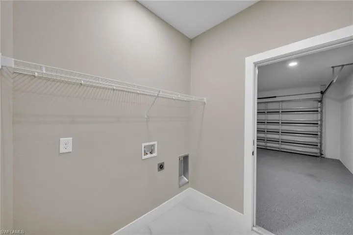Laundry room featuring washer hookup and electric dryer hookup