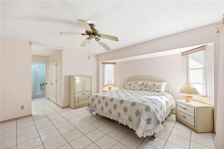 Bedroom featuring a ceiling fan and light tile patterned floors