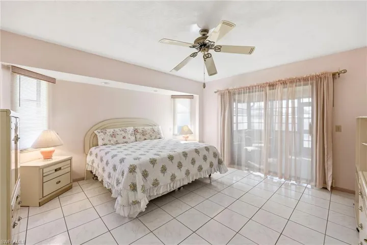 Bedroom featuring a ceiling fan and light tile patterned floors