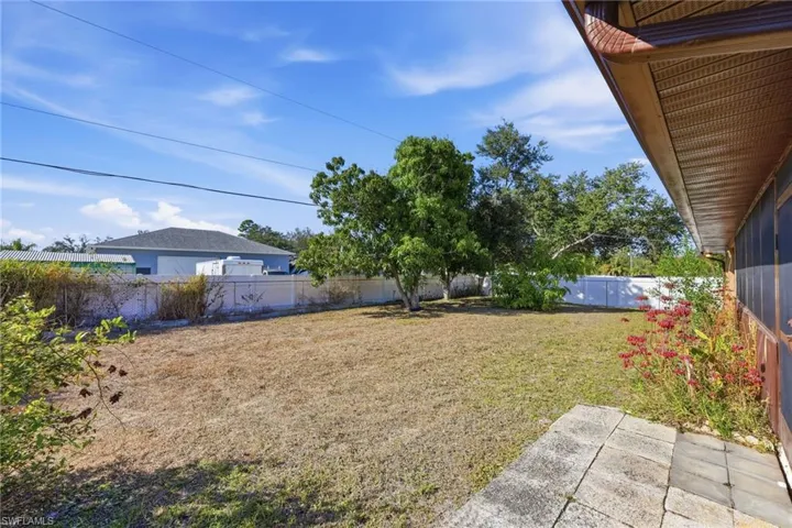 Fenced backyard featuring a patio area