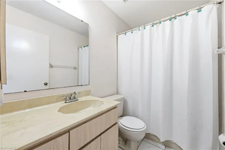 Full bath with toilet and vanity