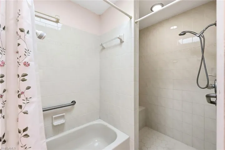 Full bathroom with tiled shower and a tub