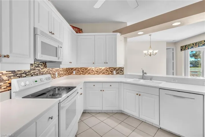 Open floor plan with views of the lake and golf course from the kitchen