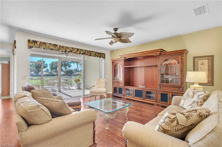 Full of natural light - living room opens to screened porch and then the lanai