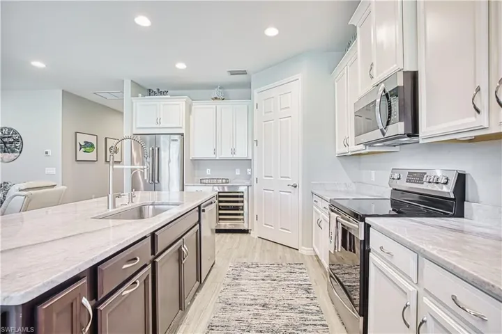 Wine refrigerator, stainless steel appliances, island