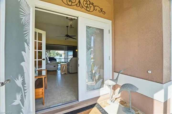 Property entrance featuring stucco siding and a patio
