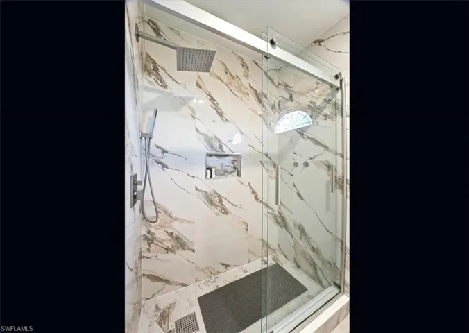 Full bathroom featuring a marble finish shower