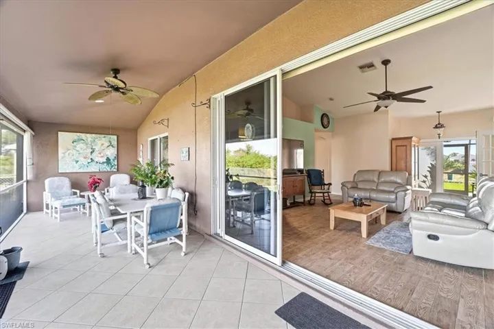 View of patio / terrace with an outdoor hangout area, ceiling fan, and a sunroom
