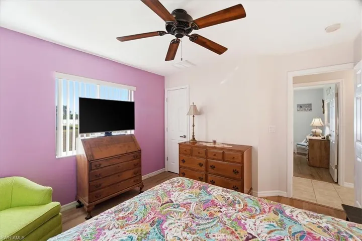 Bedroom with light wood-style flooring and ceiling fan