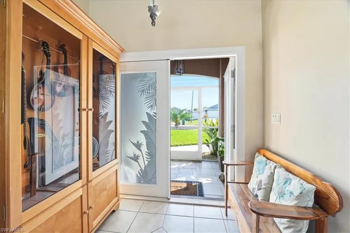 Entryway with tile patterned flooring