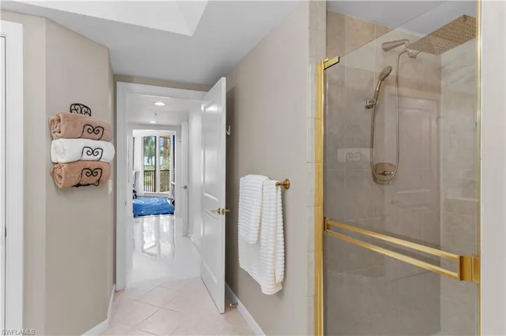 Full bathroom with tile patterned flooring and a stall shower