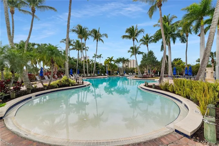 Community pool featuring a patio