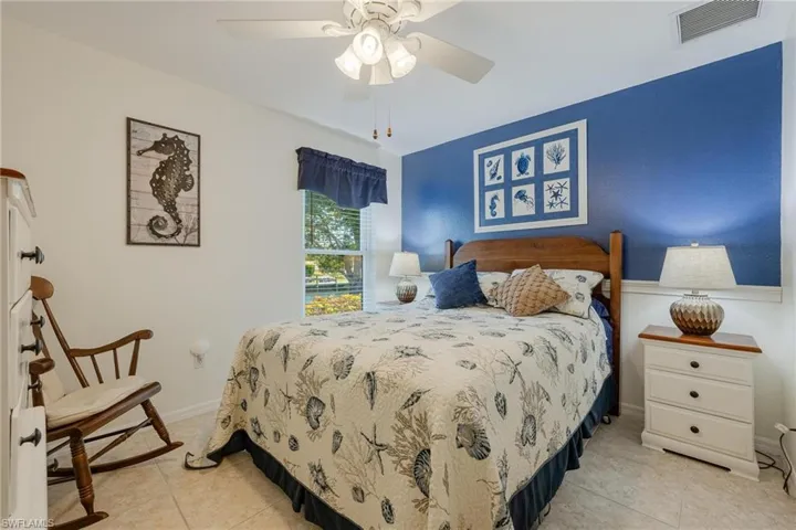 Tiled bedroom with ceiling fan