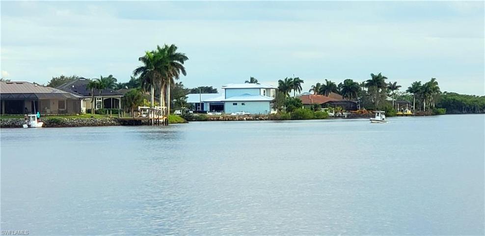 ***THIS LOVELY WATERFRONT LOT IS BY THE BLUE HOME AND THE TALL PALM TREES***