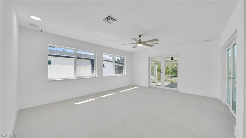 Empty room featuring baseboards and ceiling fan