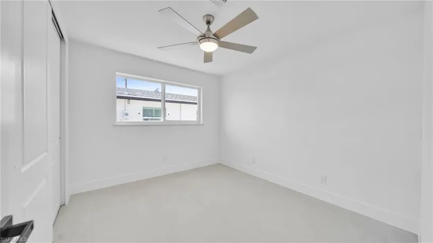 Unfurnished bedroom featuring a closet and a ceiling fan