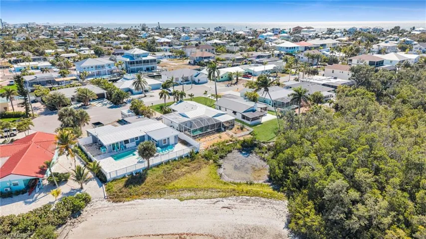 Aerial view of property's location featuring nearby suburban area
