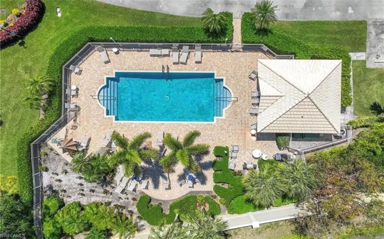 View of subject property featuring a pool area